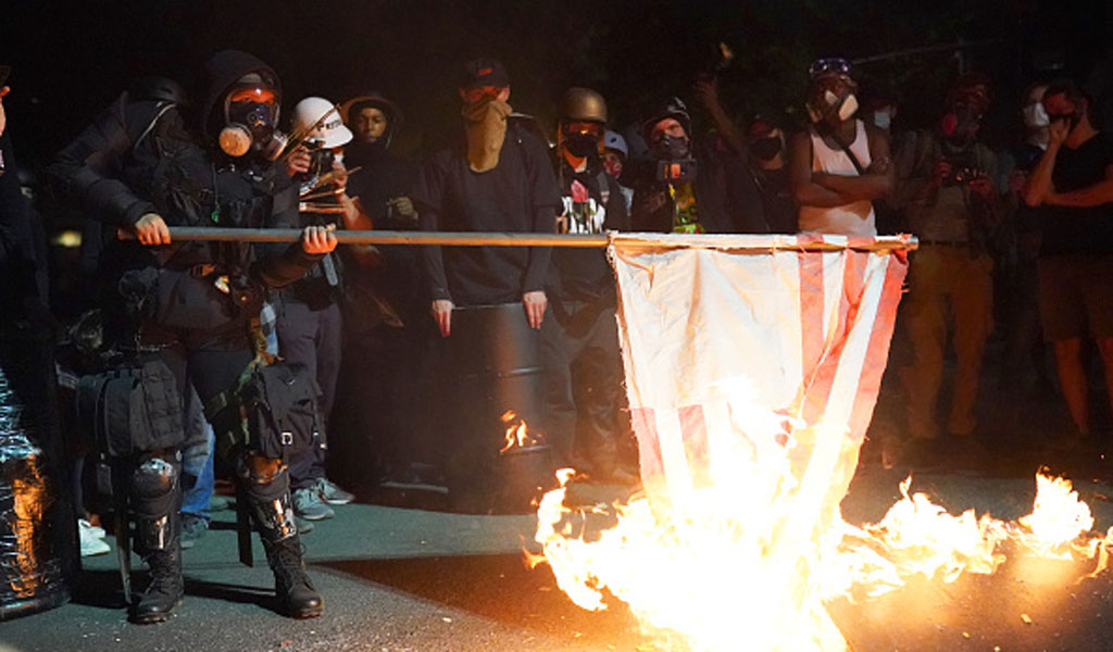 USA Portland Protesters Burn Flags Nathan Howard Getty 1024 600